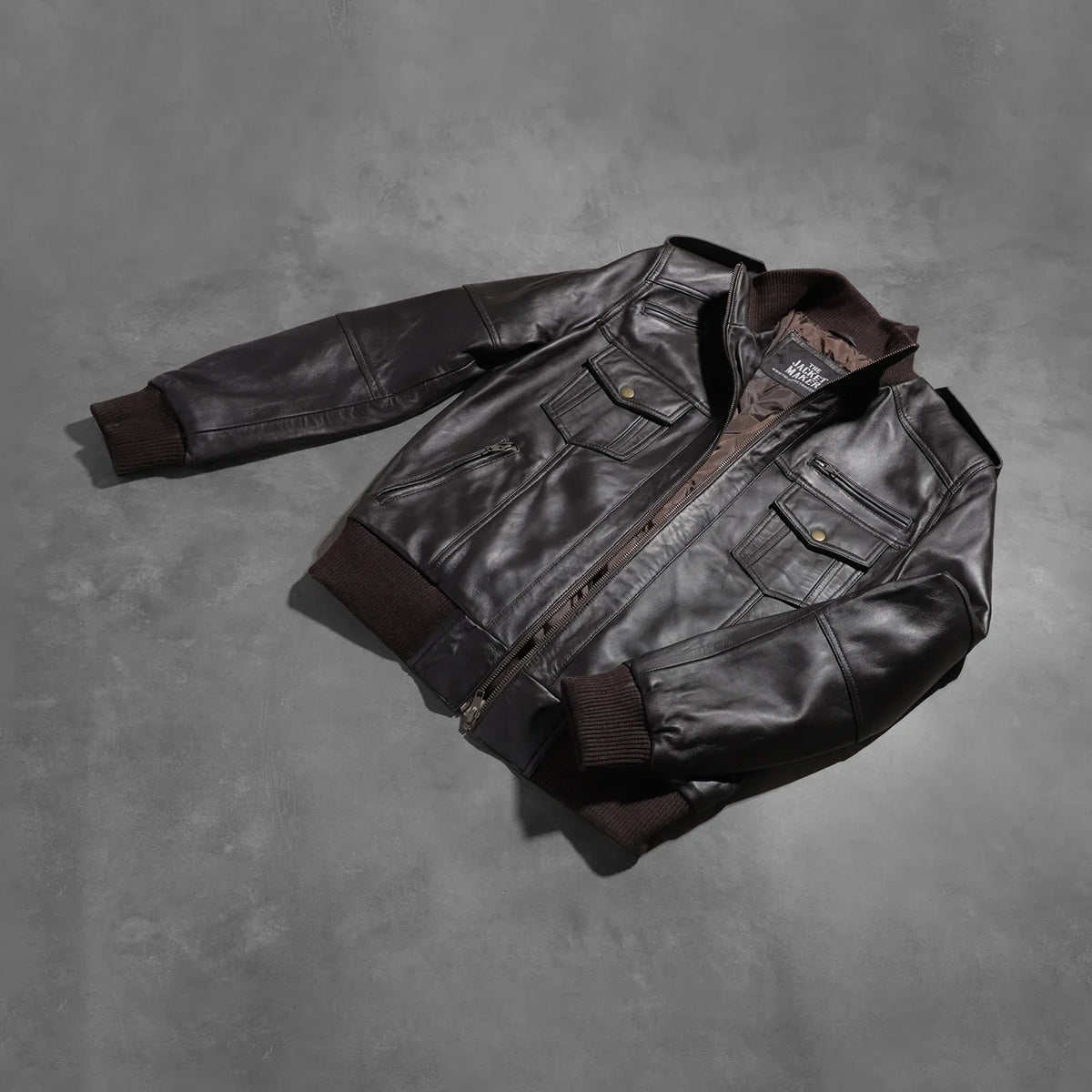 
Styled Fit Perspective of Men's Agent Shadow Brown Leather Bomber Jacket on Model - Natural Daylight Drape