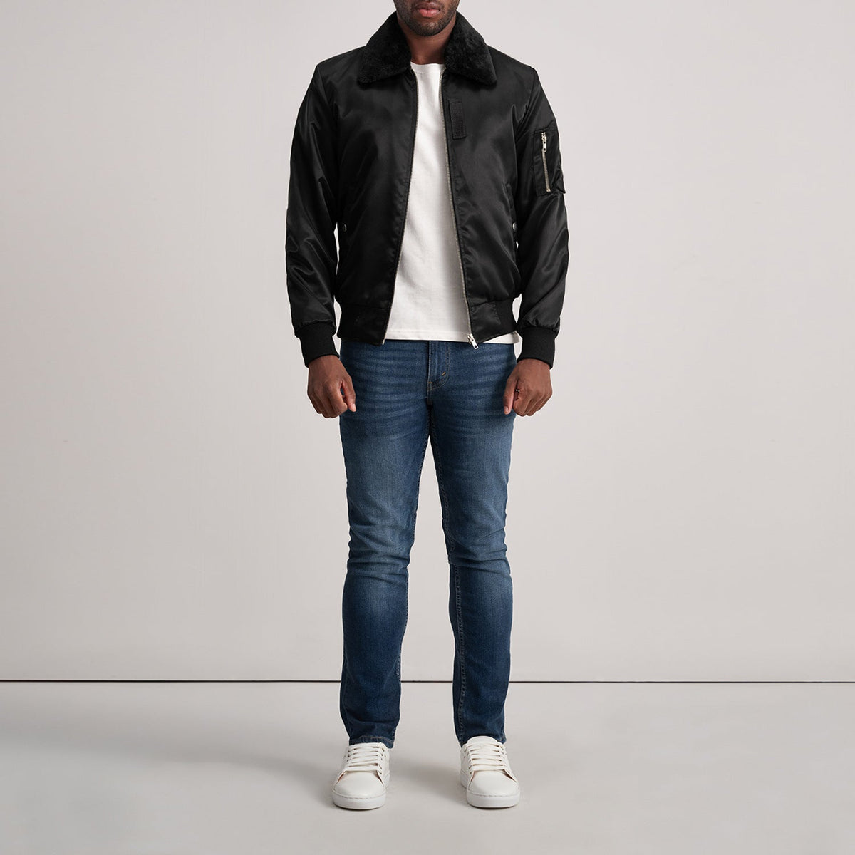 
Clyde B-15 Black Bomber Jacket - Lateral Side Profile View Showing Sleeve Cut & Athletic Taper Fit