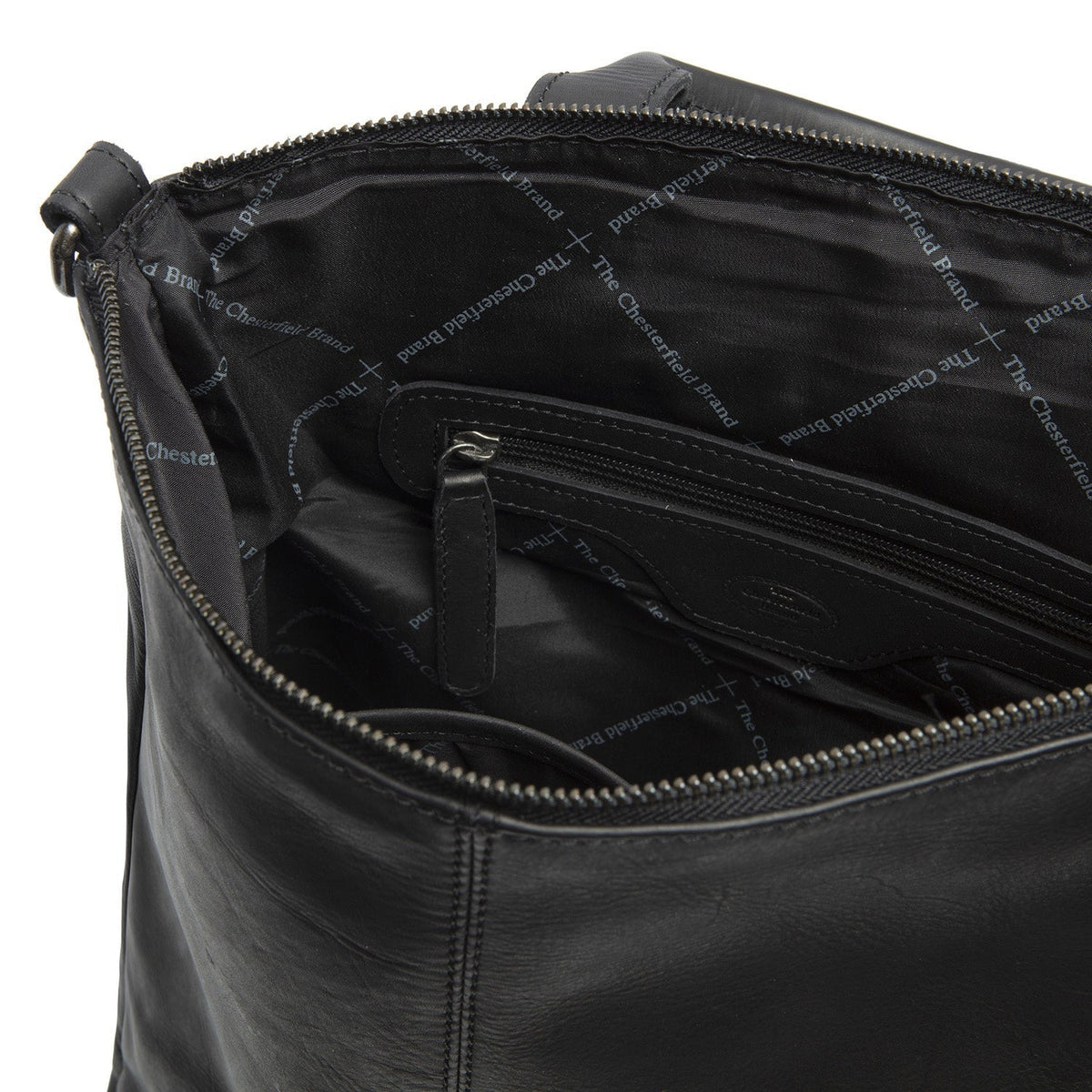 
Solid Antique Brass Hardware & Heavy-Duty Dual Zipper Detail on Manchester Full-Grain Leather Backpack