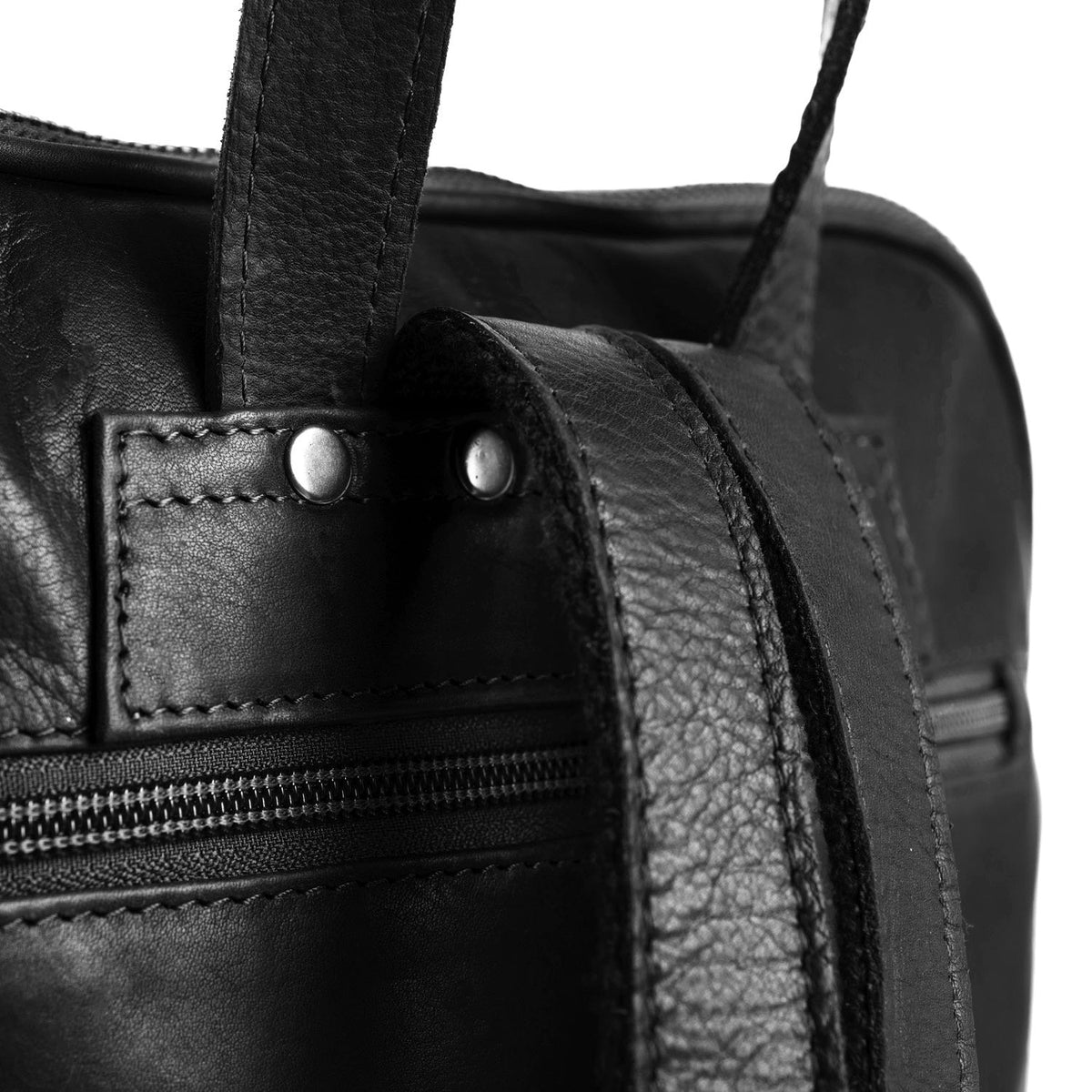 
Solid Antique Brass Hardware & Heavy-Duty Dual Zipper Detail on Naomi Full-Grain Leather Backpack