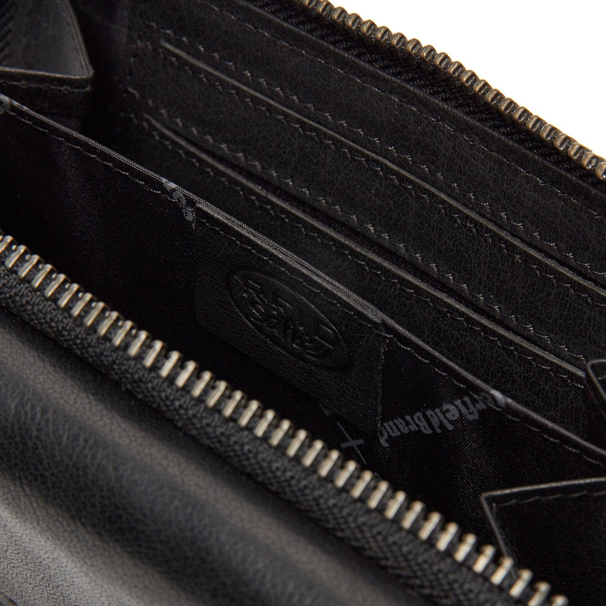 
Interior View Showing Dedicated Padded Laptop Sleeve & Multi-Compartment Organization