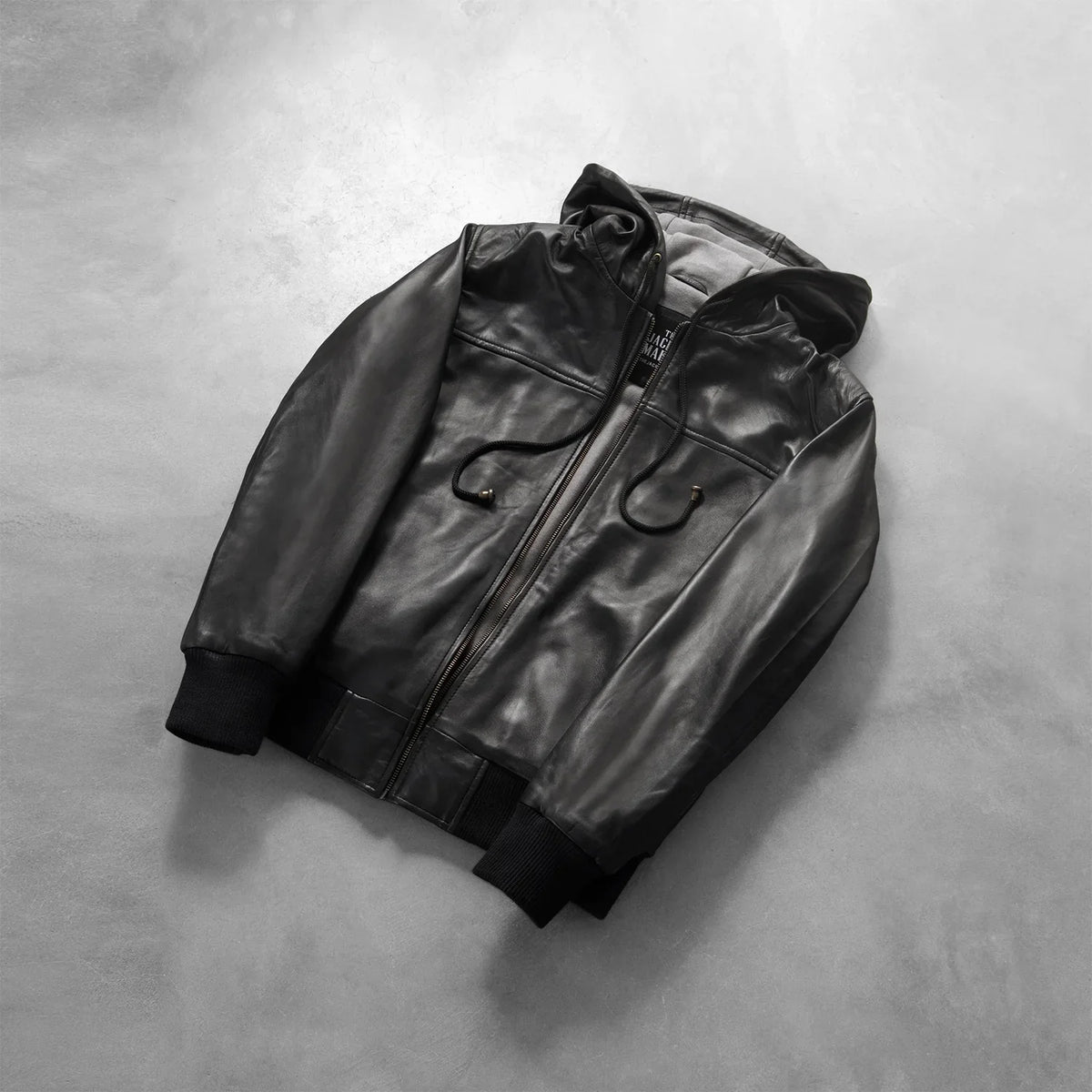 
Rib knit & Hem Craftsmanship Construction Detail on Men's Nintenzo Black Hooded Leather Jacket
